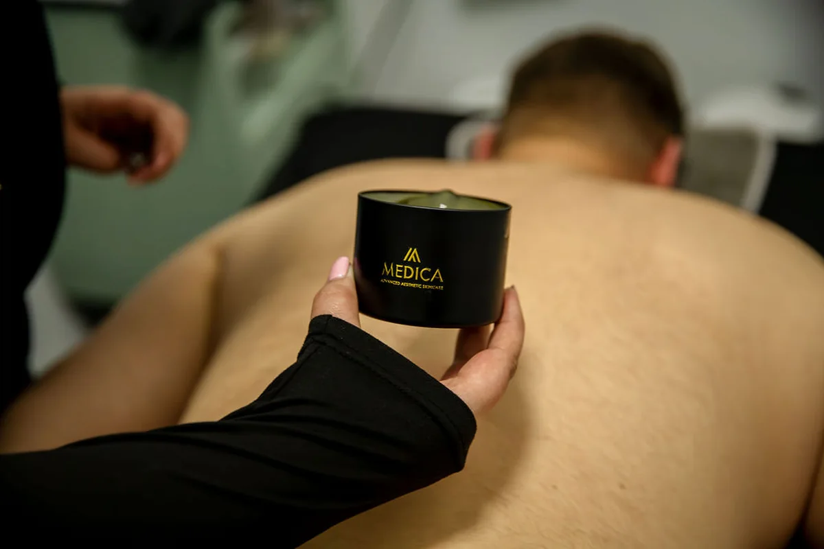 Warm aromatic candle massage treatment at MC Aesthetics in George