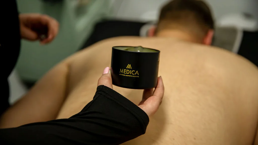 Warm aromatic candle massage treatment at MC Aesthetics in George